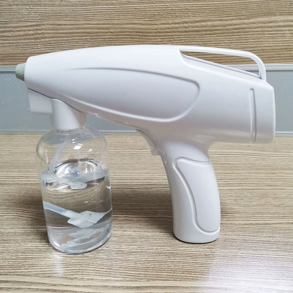 White handheld wireless disinfectant spray gun with USB-C charging port