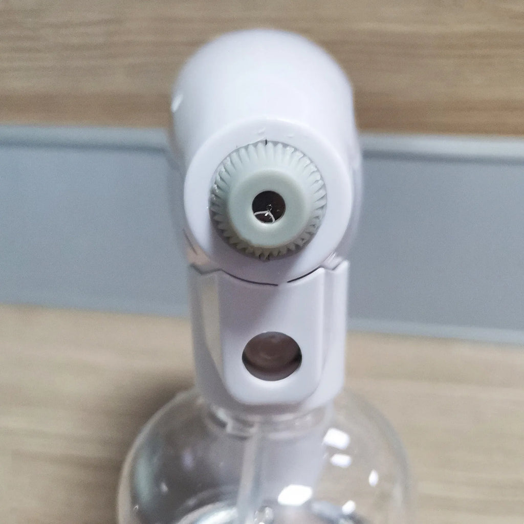 White handheld wireless disinfectant spray gun with USB-C charging port