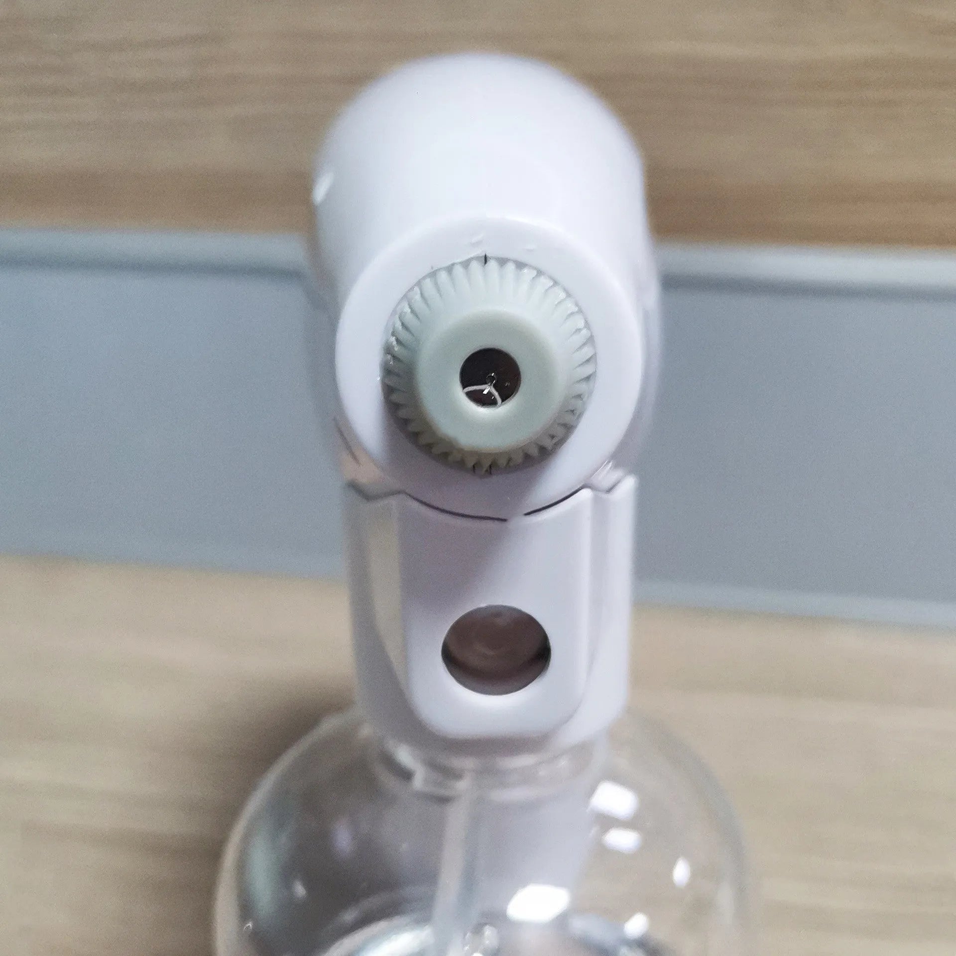 White handheld wireless disinfectant spray gun with USB-C charging port