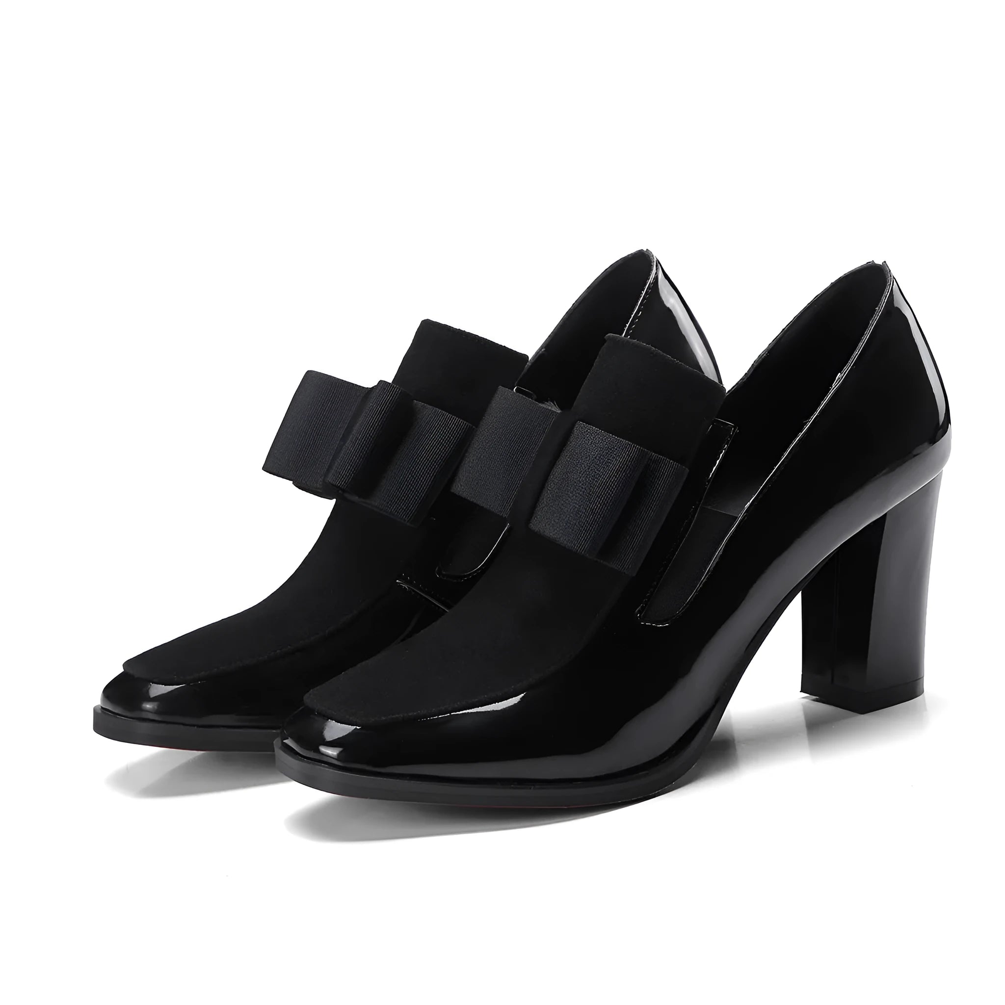 Black patent leather high heels with a thick block heel and square toe on a white background.