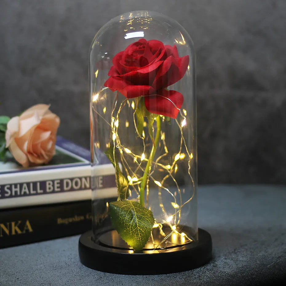 LED illuminated artificial rose bouquet with glass dome cover on table, 30cm tall.