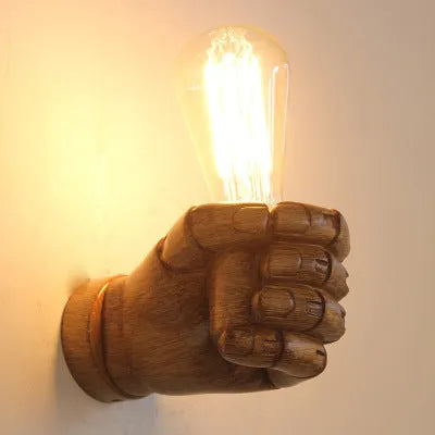Creative resin fist-shaped wall lamp for bar or corridor background lighting in black, white, or wood grain.