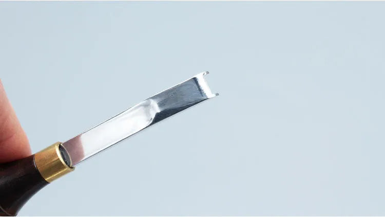 Sectional cutting wide shovel edge thinning hand tool for leatherworking.