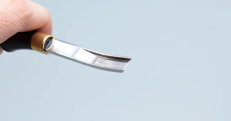 Sectional cutting wide shovel edge thinning hand tool for leatherworking.