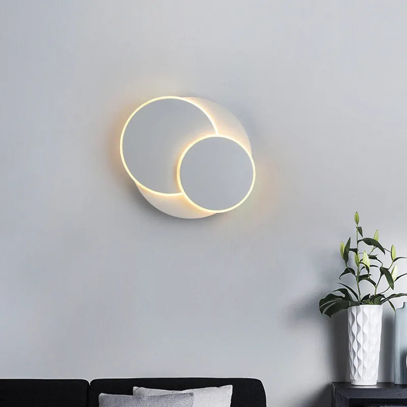 Modern round wall lamp with acrylic shade in black or white colour
