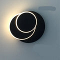 Modern round wall lamp with acrylic shade in black or white colour