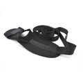 Black polyester cotton yoga stretch strap for flexibility and split training, packed on a flat surface