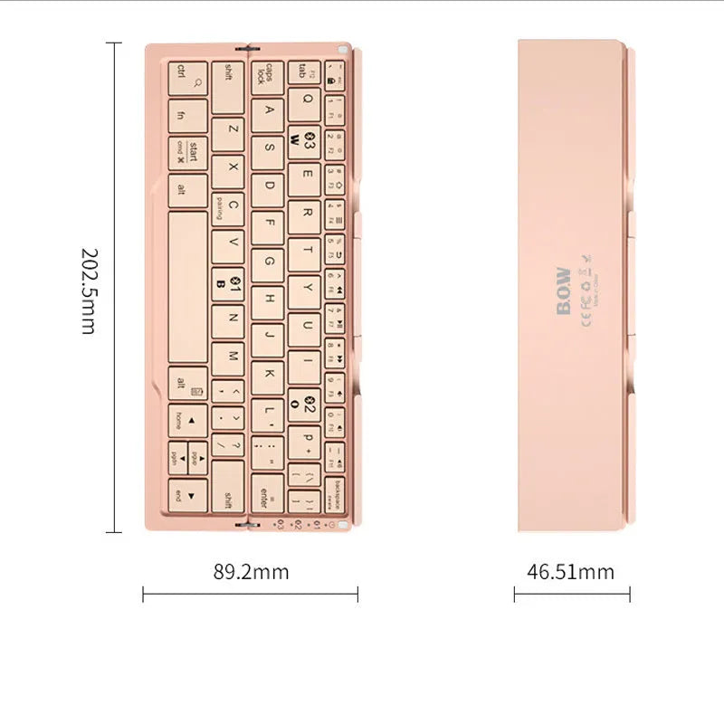 Aluminium folding Bluetooth keyboard with stand supporting smartphone, showing compact folded size