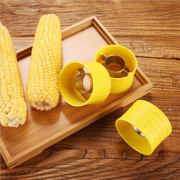 Yellow manual corn grinder thresher with corn-shaped PP handle and stainless steel shelling gear.