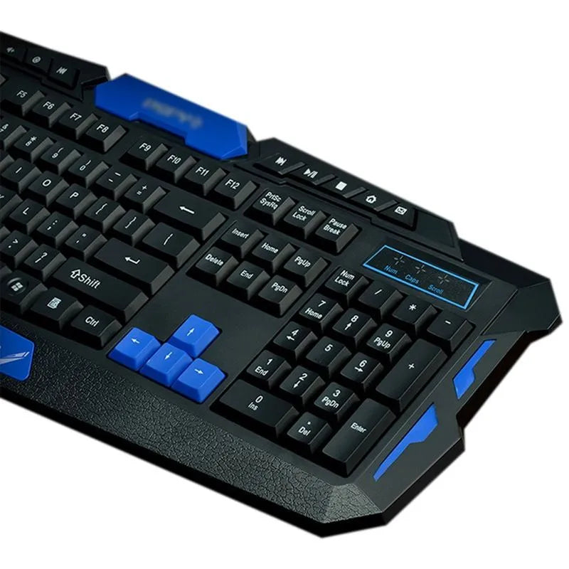 Black wireless keyboard and mouse with blue accents on desk