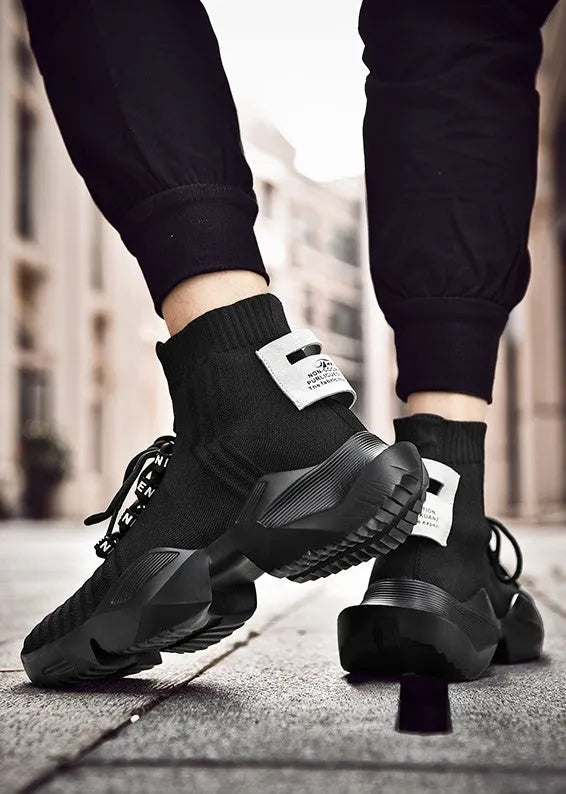Men's black and white sports casual shoes showing mesh inside and available in sizes UK 39 to 47