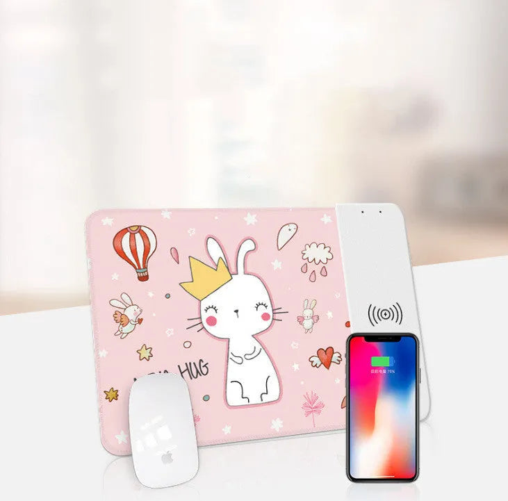 Wireless charging mouse pad with cartoon design and RGB lighting, showing cloth surface and rubber base