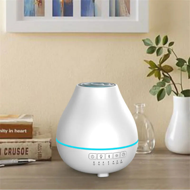 White round Bluetooth aromatherapy humidifier diffuser with LED night light on a wooden surface