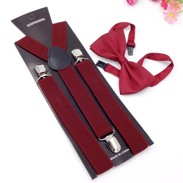 Men's back tie bow tie suspenders set in elastic webbing with snap fastening showing navy colour on a plain background