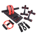 Green resistance bands push-up bar abdominal fitness machine on a floor, shown as part of a multi-piece portable set.