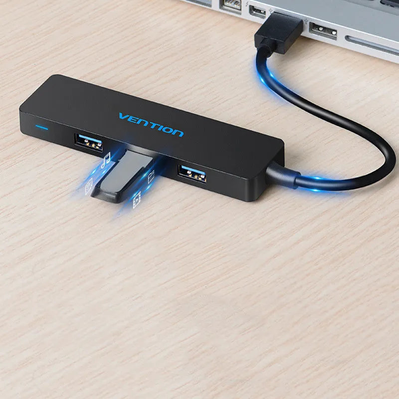 Black USB 3.0 four-port hub with a short cable and nickel-plated connectors