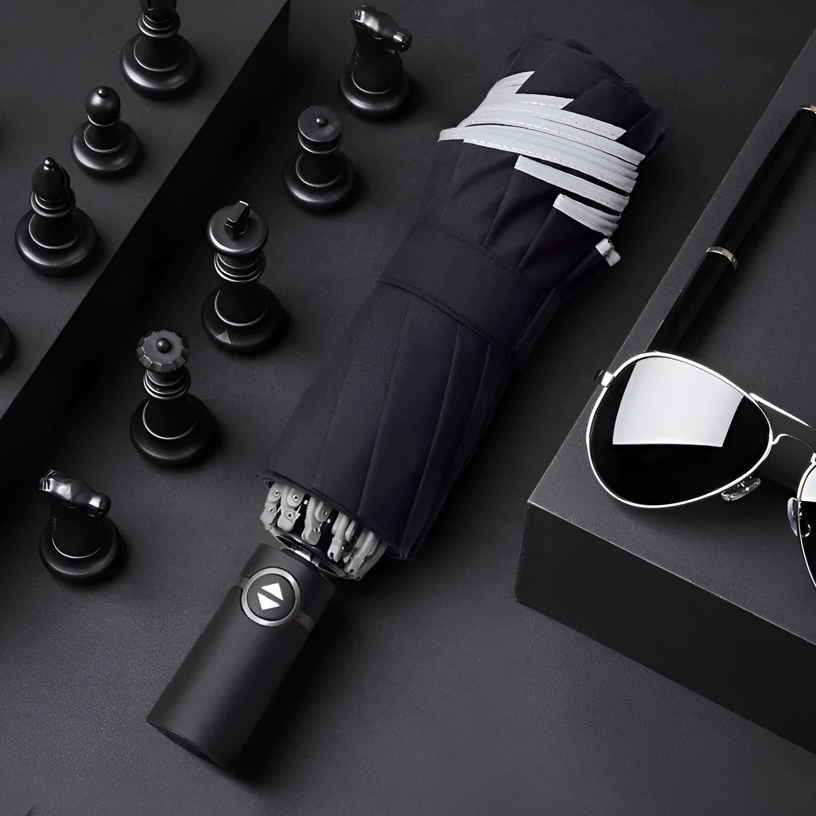 Black automatic reverse folding umbrella with plastic non-slip handle, shown open.