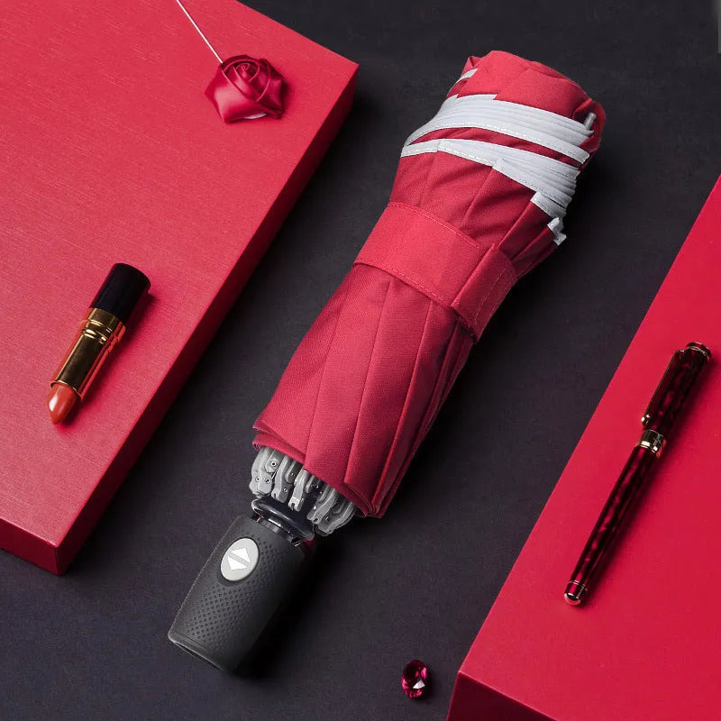 Black automatic reverse folding umbrella with plastic non-slip handle, shown open.