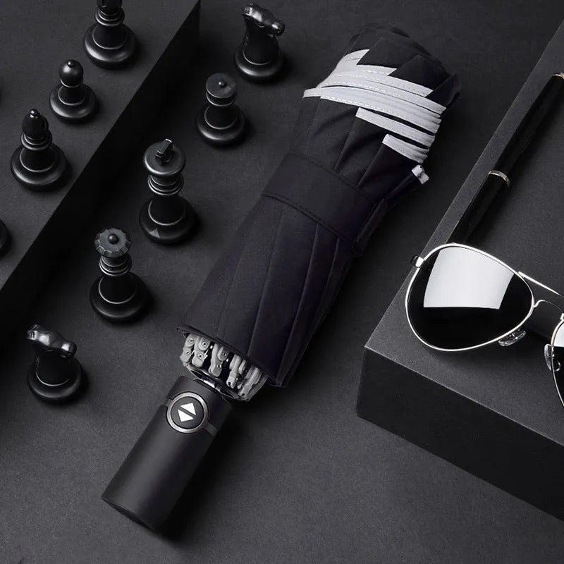 Black automatic reverse folding umbrella with plastic non-slip handle, shown open.