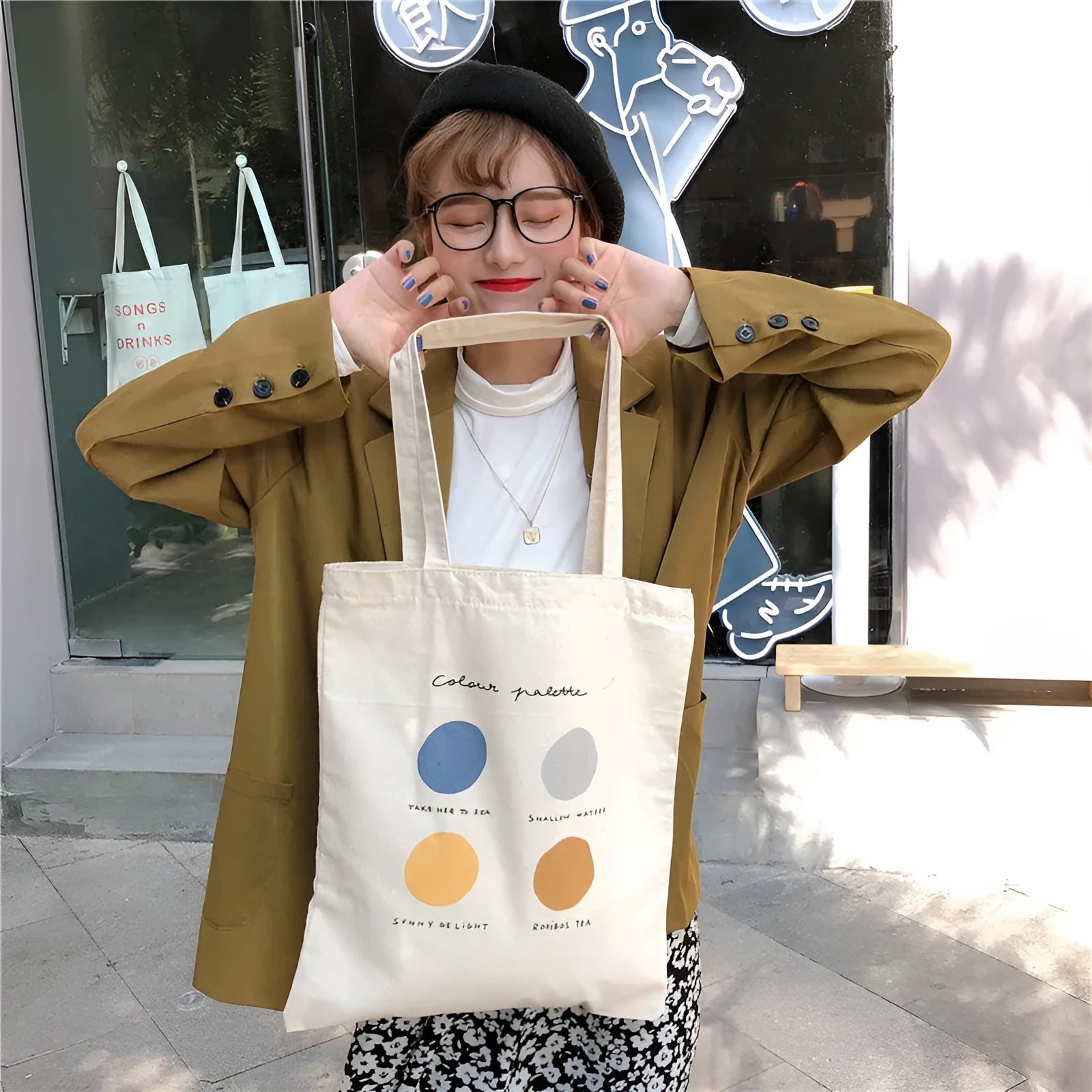 Women's medium canvas tote bag with geometric pattern, zipper closure, and shoulder straps in orange or light pink colour