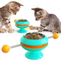 Rotating turntable cat toy with catnip balls and suction cup base in lake blue colour