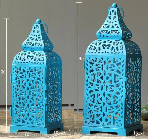 Geometric hollow iron Moroccan lantern candlestick in retro style, shown in blue colour.
