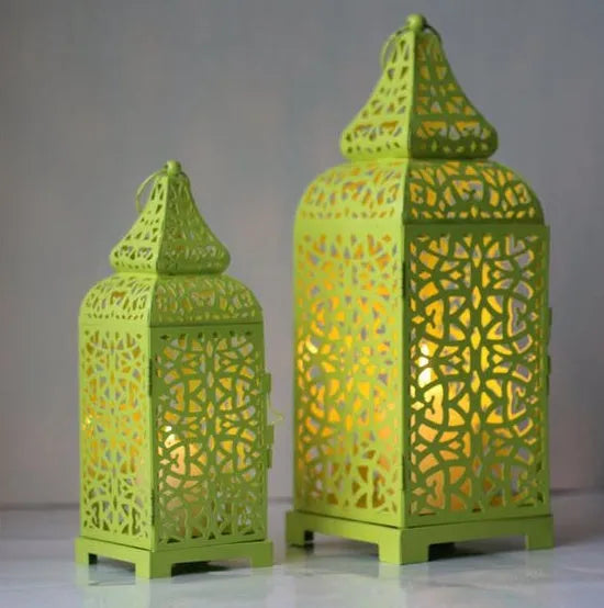Geometric hollow iron Moroccan lantern candlestick in retro style, shown in blue colour.