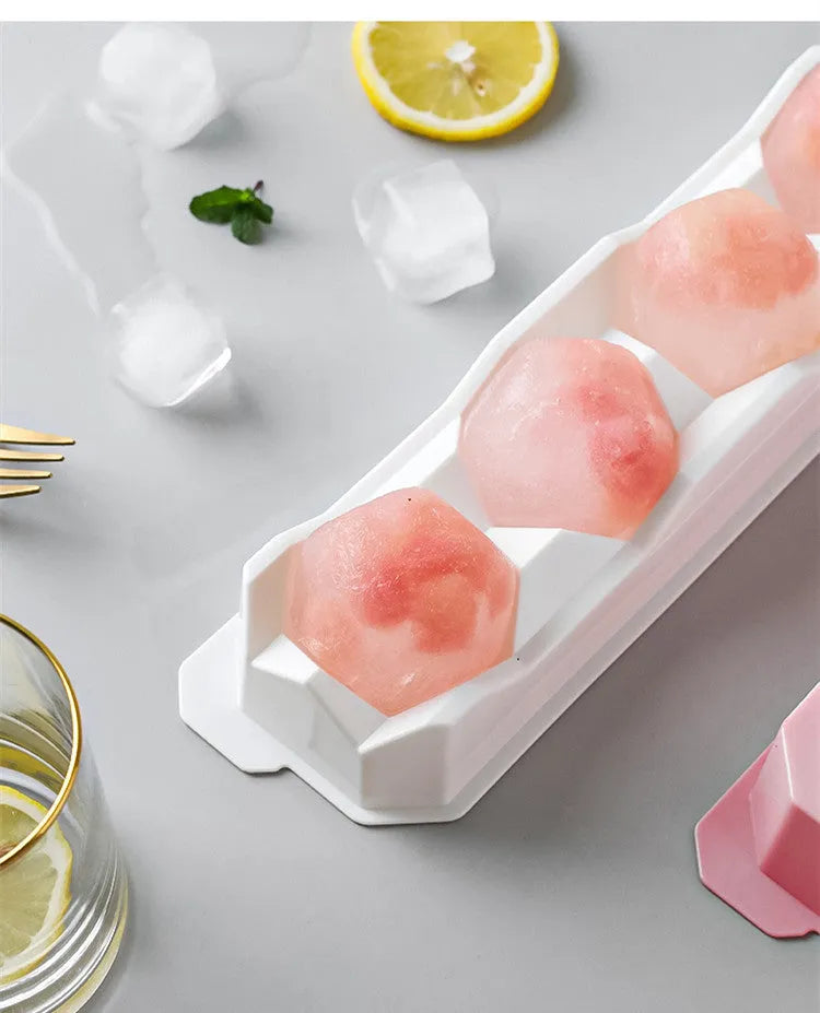Silicone ice tray showing hockey artefact moulds and spherical ice cavities in light blue colour