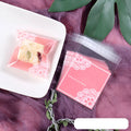 Pink self-adhesive plastic packaging bags for handmade soap, measuring 7x7 cm