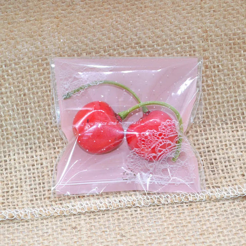 Pink self-adhesive plastic packaging bags for handmade soap, measuring 7x7 cm