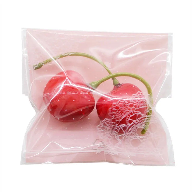 Pink self-adhesive plastic packaging bags for handmade soap, measuring 7x7 cm
