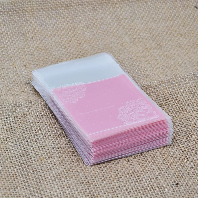 Pink self-adhesive plastic packaging bags for handmade soap, measuring 7x7 cm