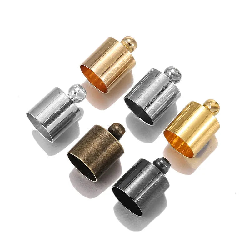 Assorted copper weight caps and tassel caps in gold, silver, and bronze electroplated finishes for jewellery making.