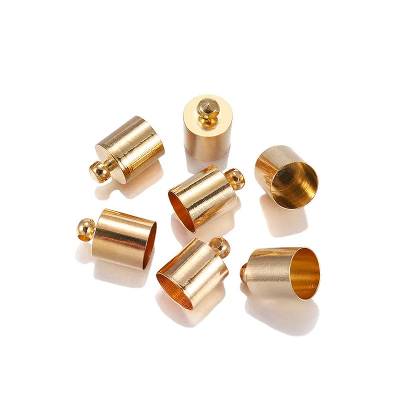 Assorted copper weight caps and tassel caps in gold, silver, and bronze electroplated finishes for jewellery making.
