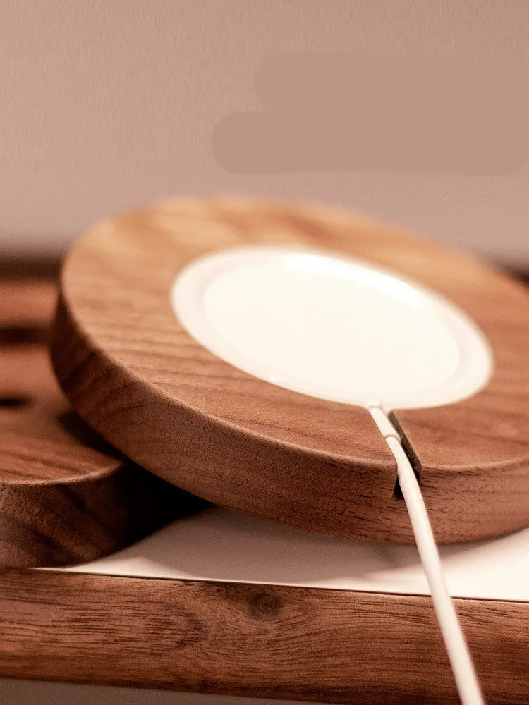 Walnut wood magnetic wireless charging stand with phone on bracket