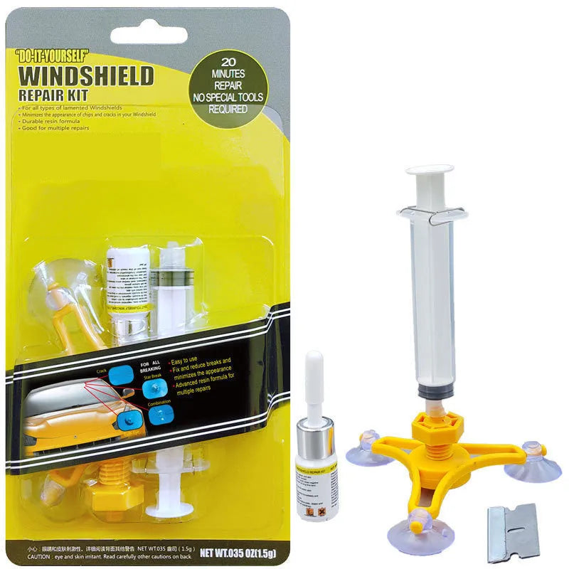 Yellow auto glass repair tool with triangle bracket and 2ml fluid on car windshield
