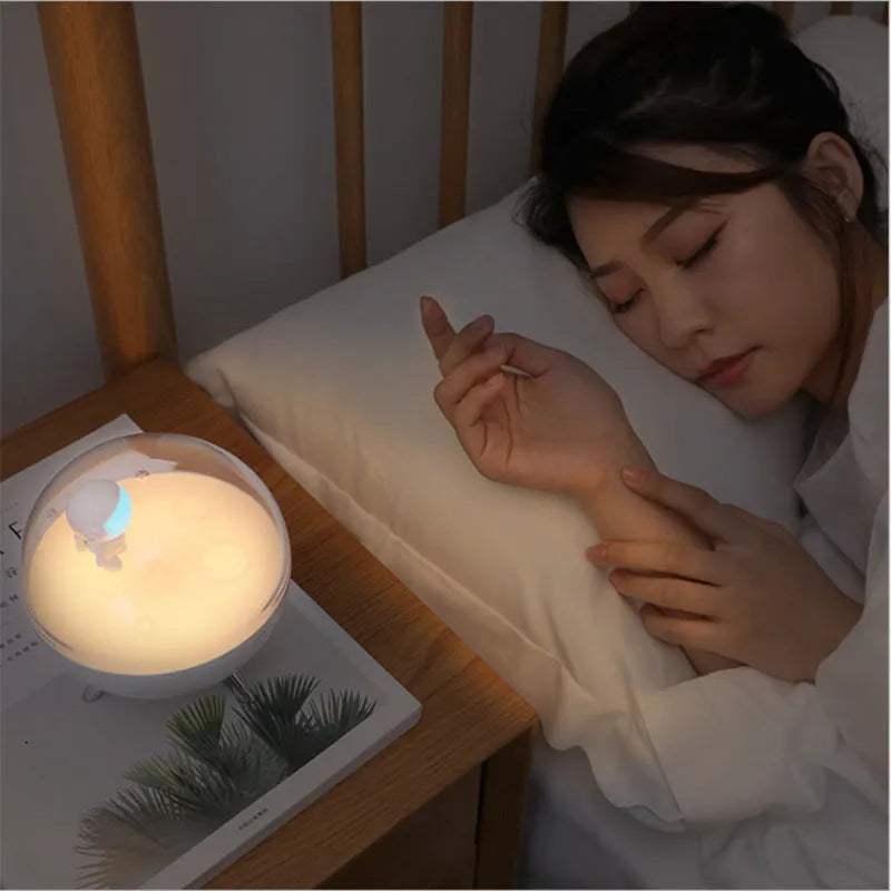 Guardian-shaped cartoon LED night light with plastic shade and USB cable.
