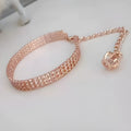 Gold dog collar with crown pattern and three drain diamond rhinestone detail on copper base
