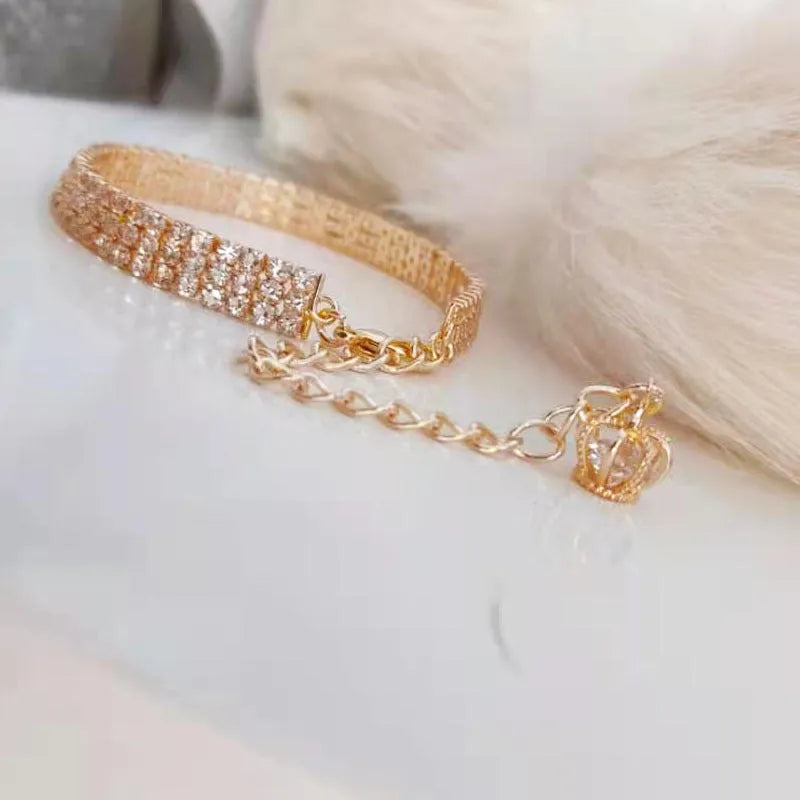 Gold dog collar with crown pattern and three drain diamond rhinestone detail on copper base