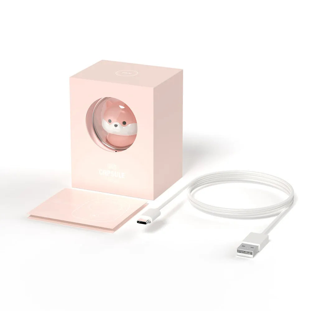 White handheld neck fan with USB port and cute animal design, shown next to its packaging.
