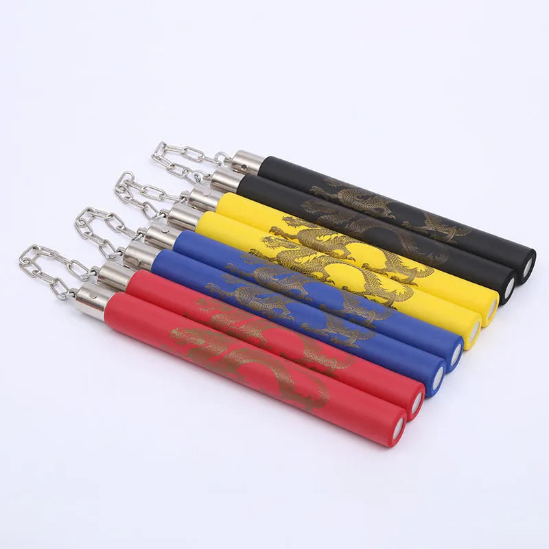 Red and blue sponge-covered nunchaku training sticks connected by a metal chain on a grey background.