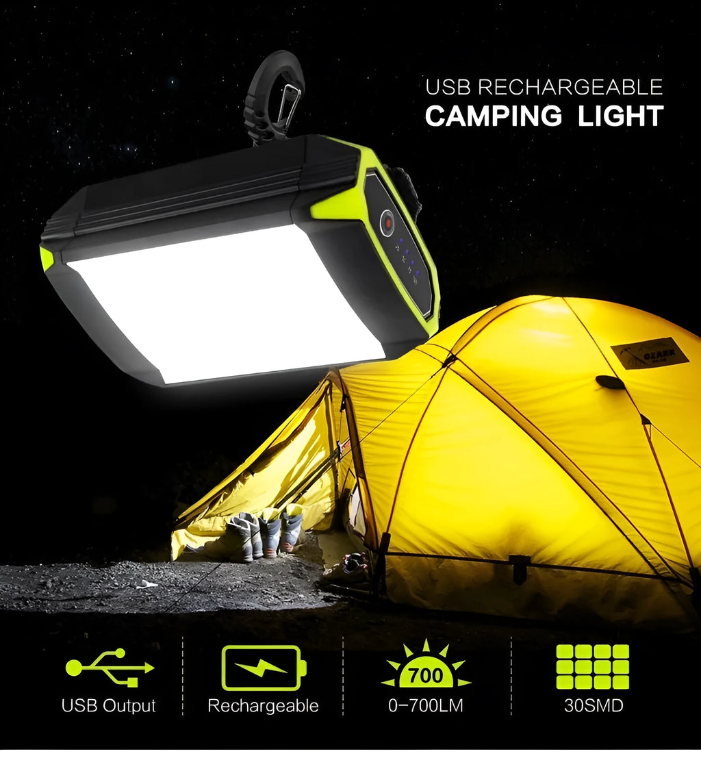 Green rechargeable LED camping light with dimming function and USB power bank port.