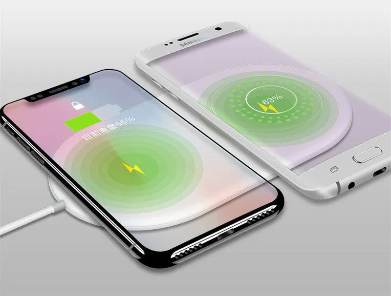 White dual wireless charging pad for two mobile phones.