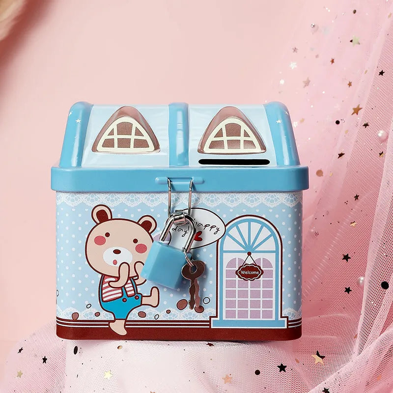 Blue house-shaped tinplate piggy bank for coin saving on a wooden desk