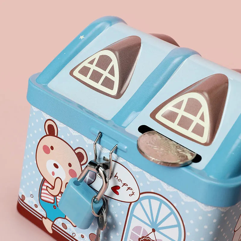 Blue house-shaped tinplate piggy bank for coin saving on a wooden desk