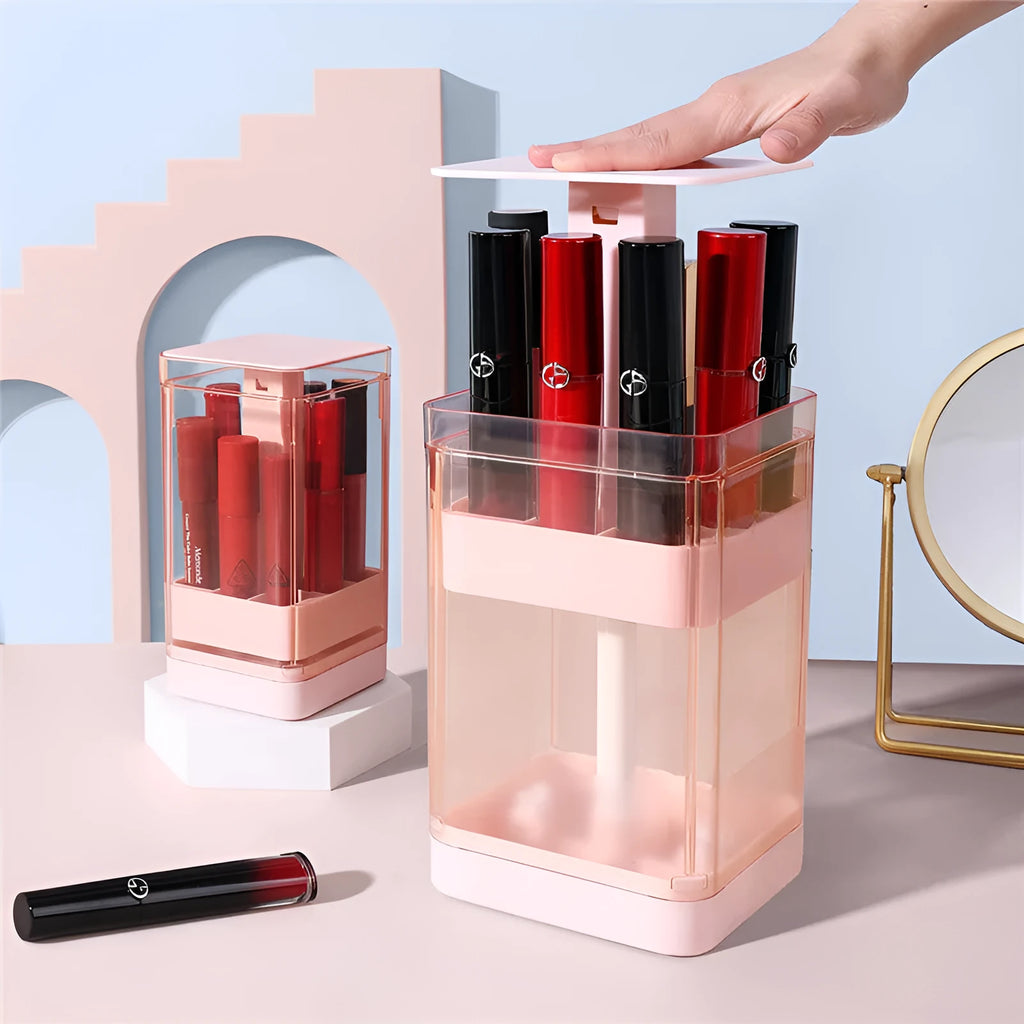 Clear press lift lipstick storage box with dust-proof cover on a desktop, showing pink and white colour options.