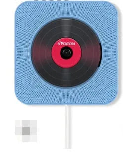 Wall-mounted CD and DVD player unit in white colour with remote control on a table.