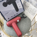 God fascia gun muscle massager in black, red, and grey colour options with USB charging port.
