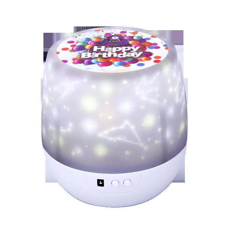 Starry sky projector night light projecting cosmic patterns, showing plastic body with push button.