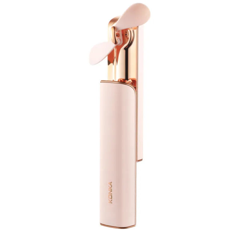 Small pink folding handheld fan with USB charging port and two-speed button.